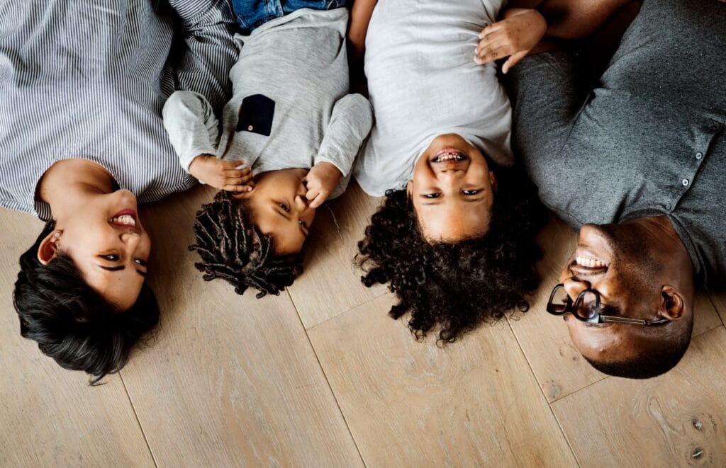 Family Laying on Floors From Bradley Floorings of Augusta, GA